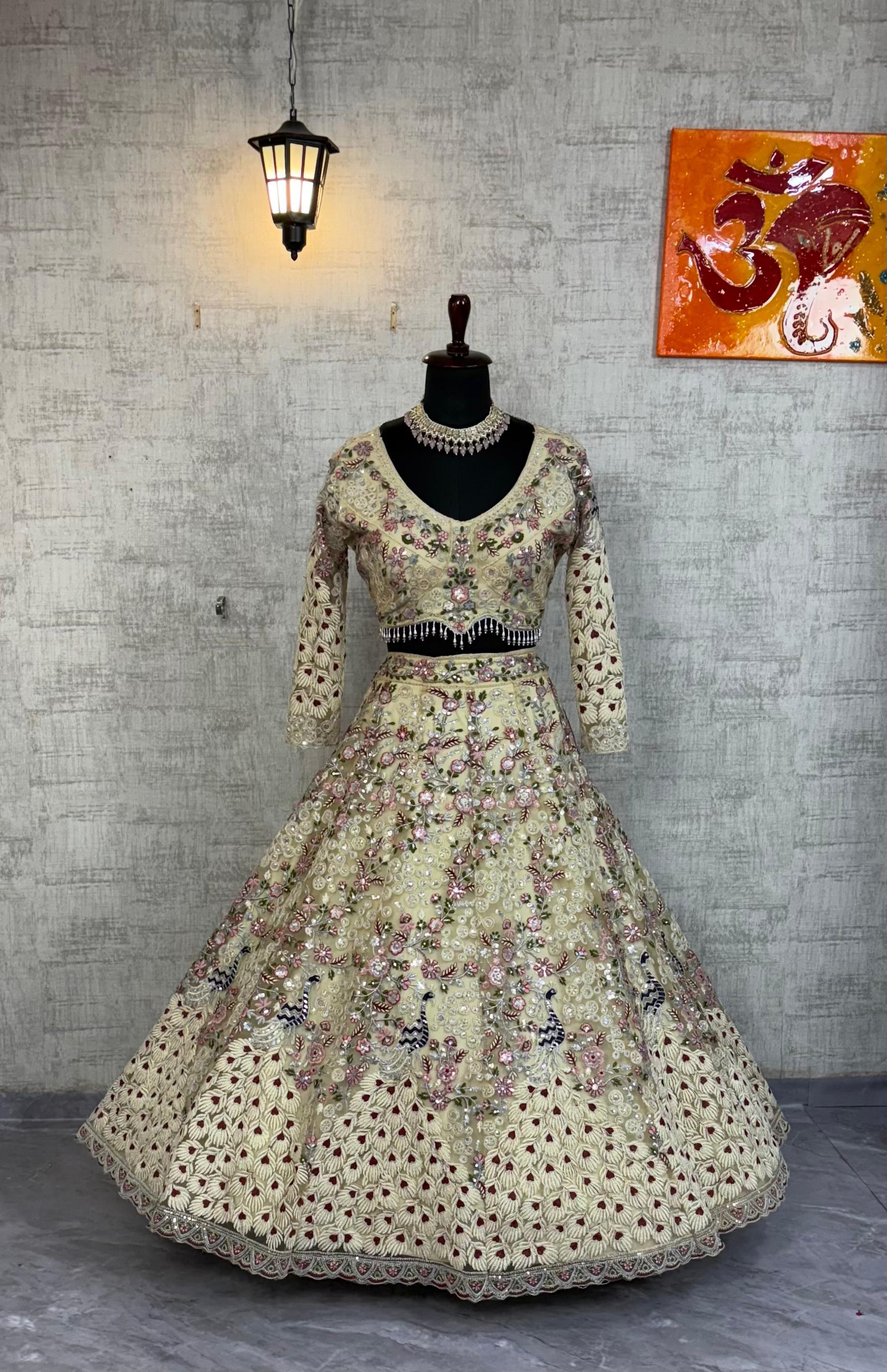 Cream Embroidered Net Lehenga Choli with Floral Detailing