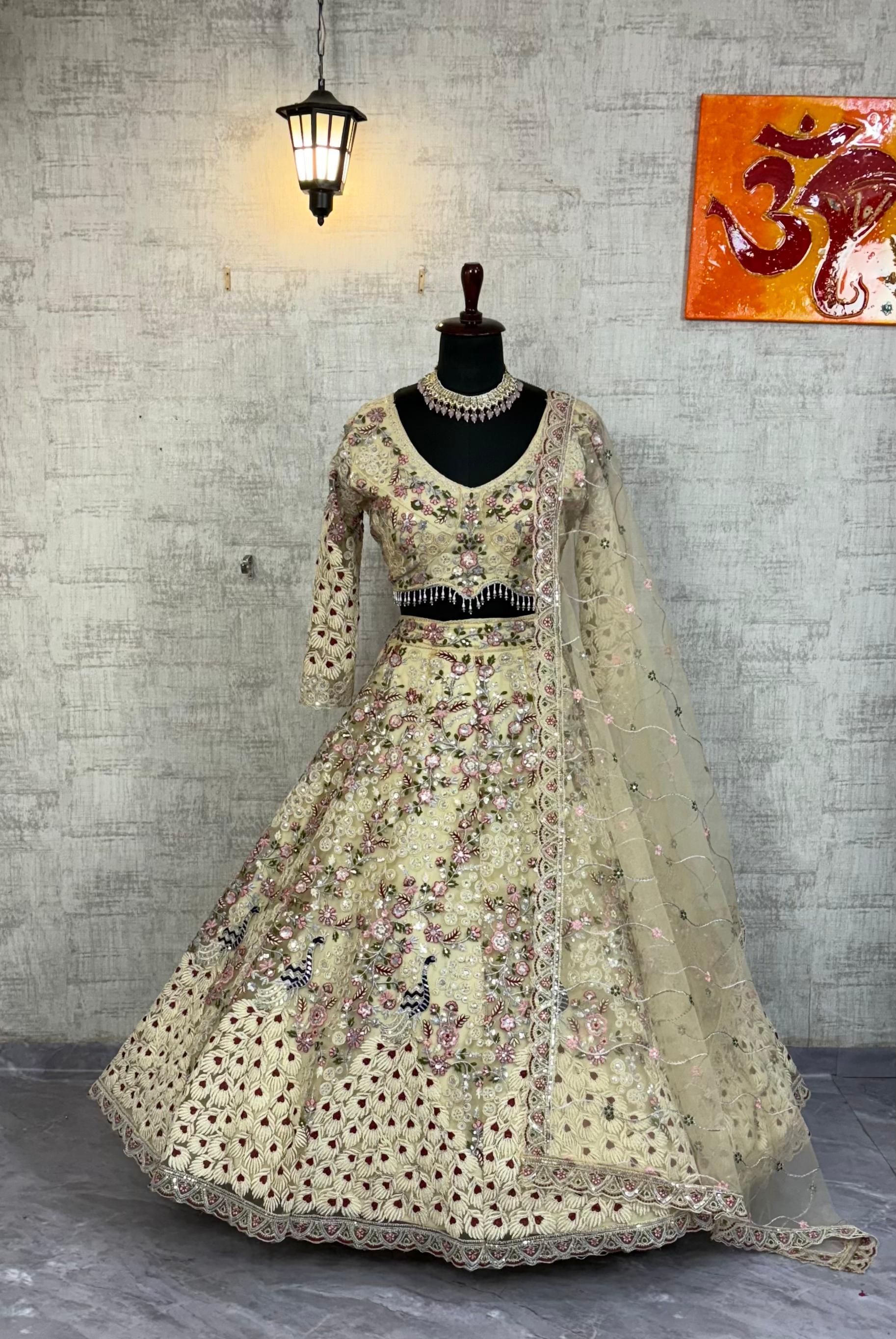 Cream Embroidered Net Lehenga Choli with Floral Detailing