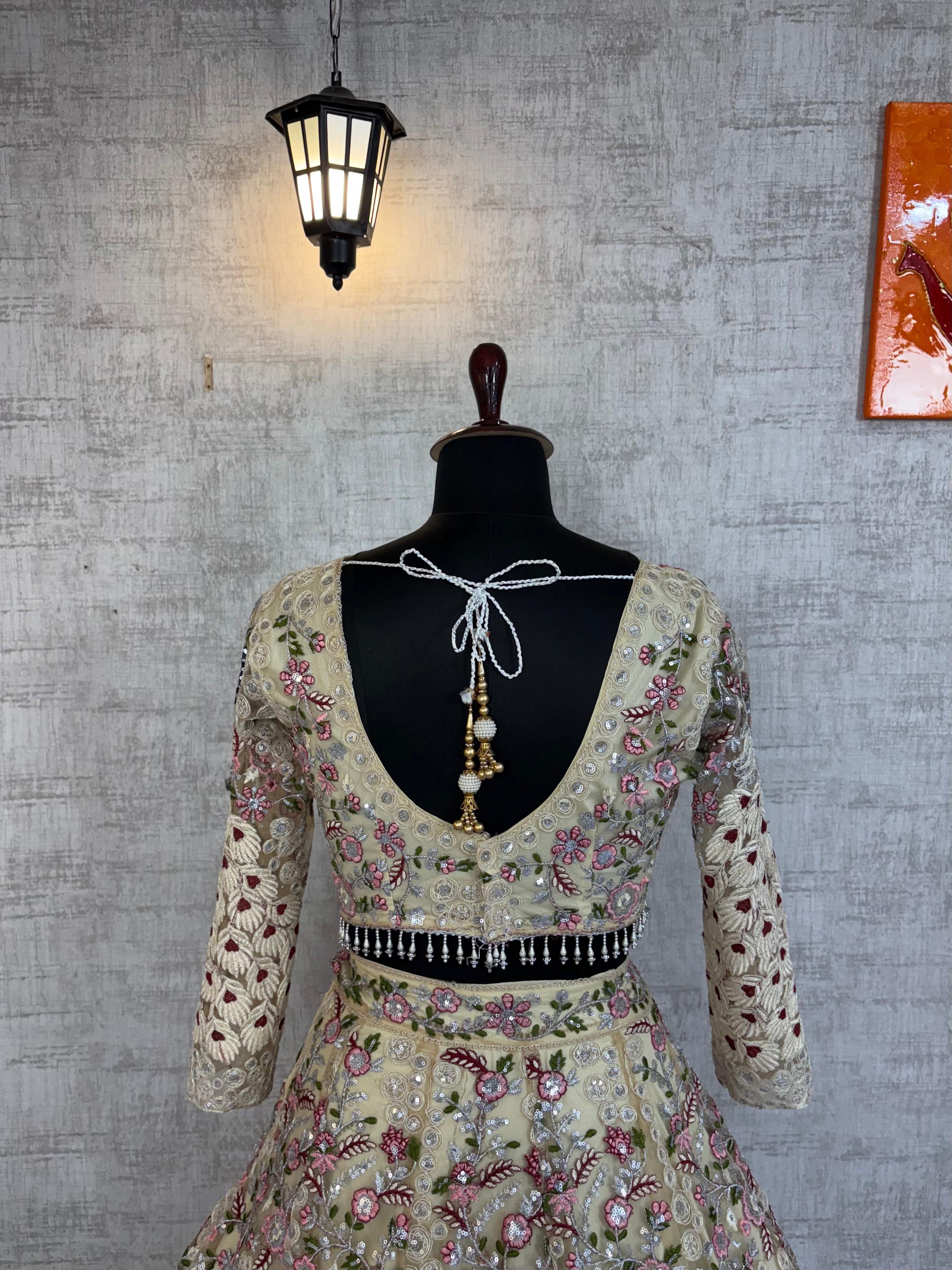 Cream Embroidered Net Lehenga Choli with Floral Detailing