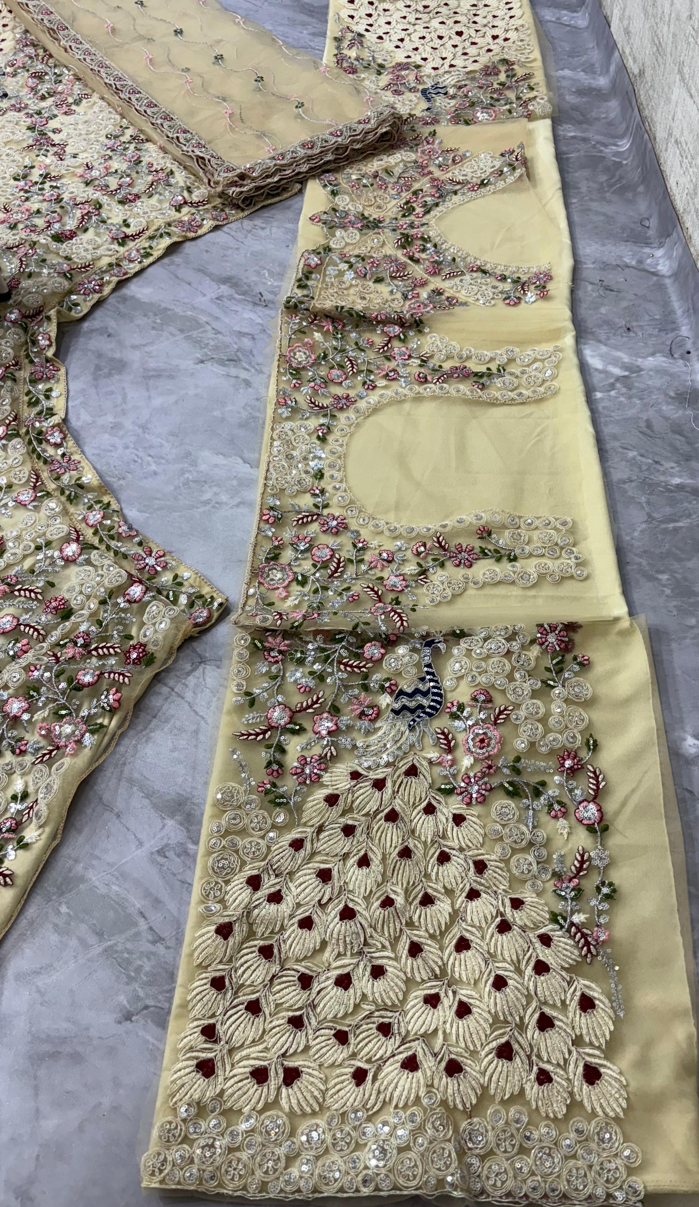 Cream Embroidered Net Lehenga Choli with Floral Detailing