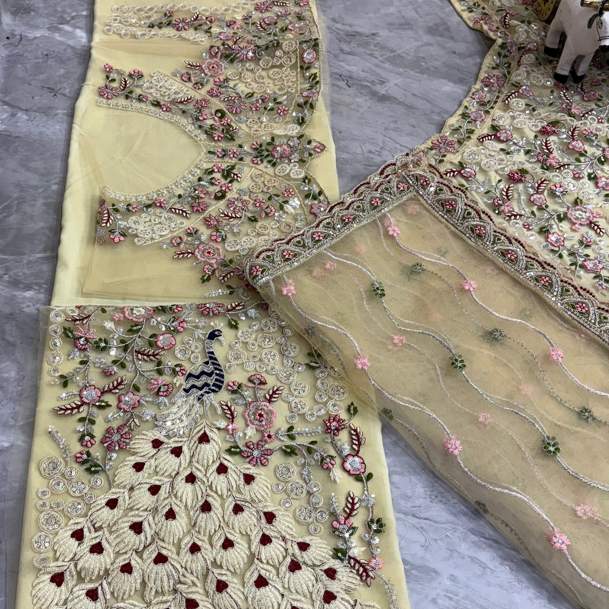 Cream Embroidered Net Lehenga Choli with Floral Detailing