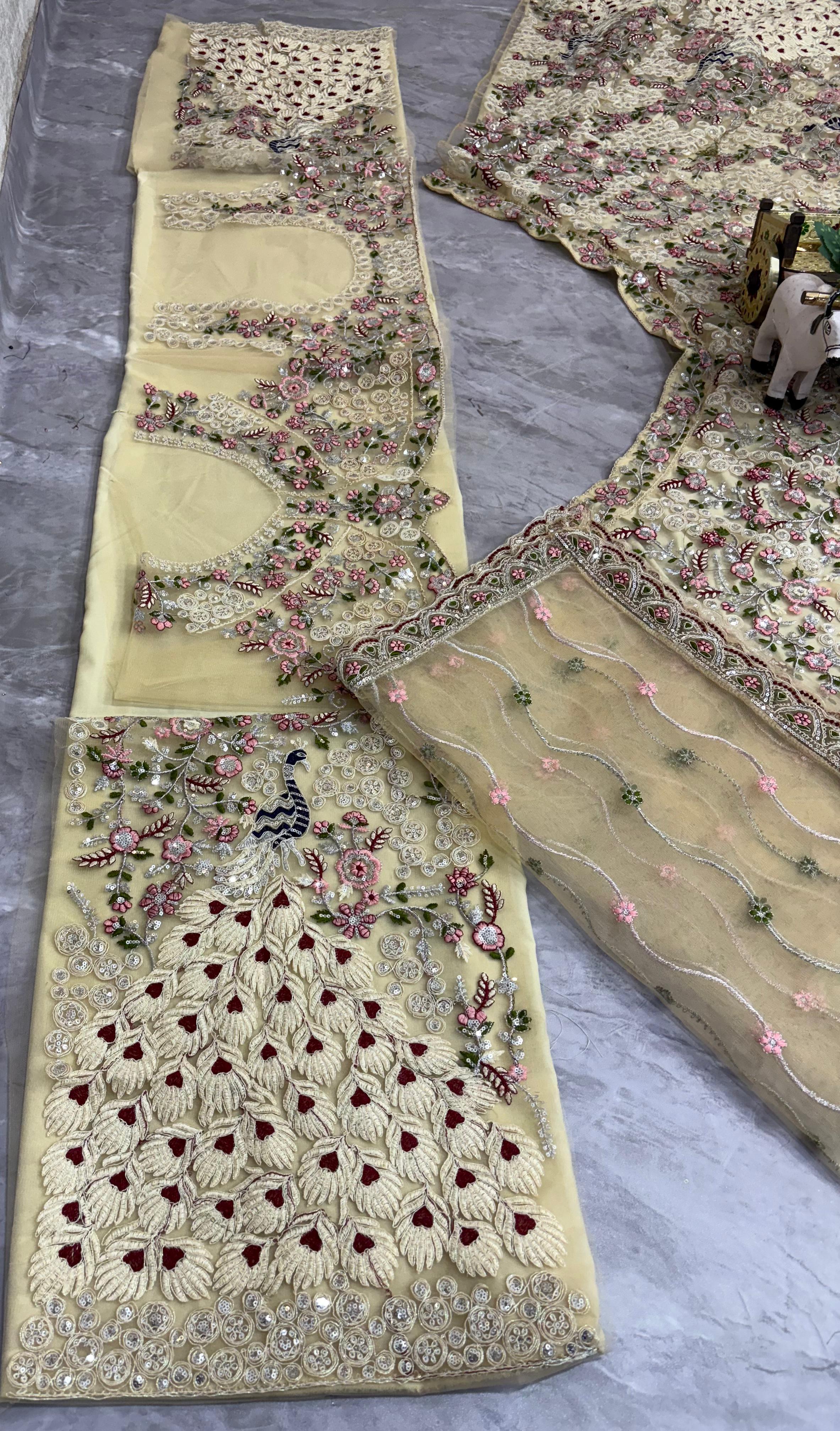 Cream Embroidered Net Lehenga Choli with Floral Detailing