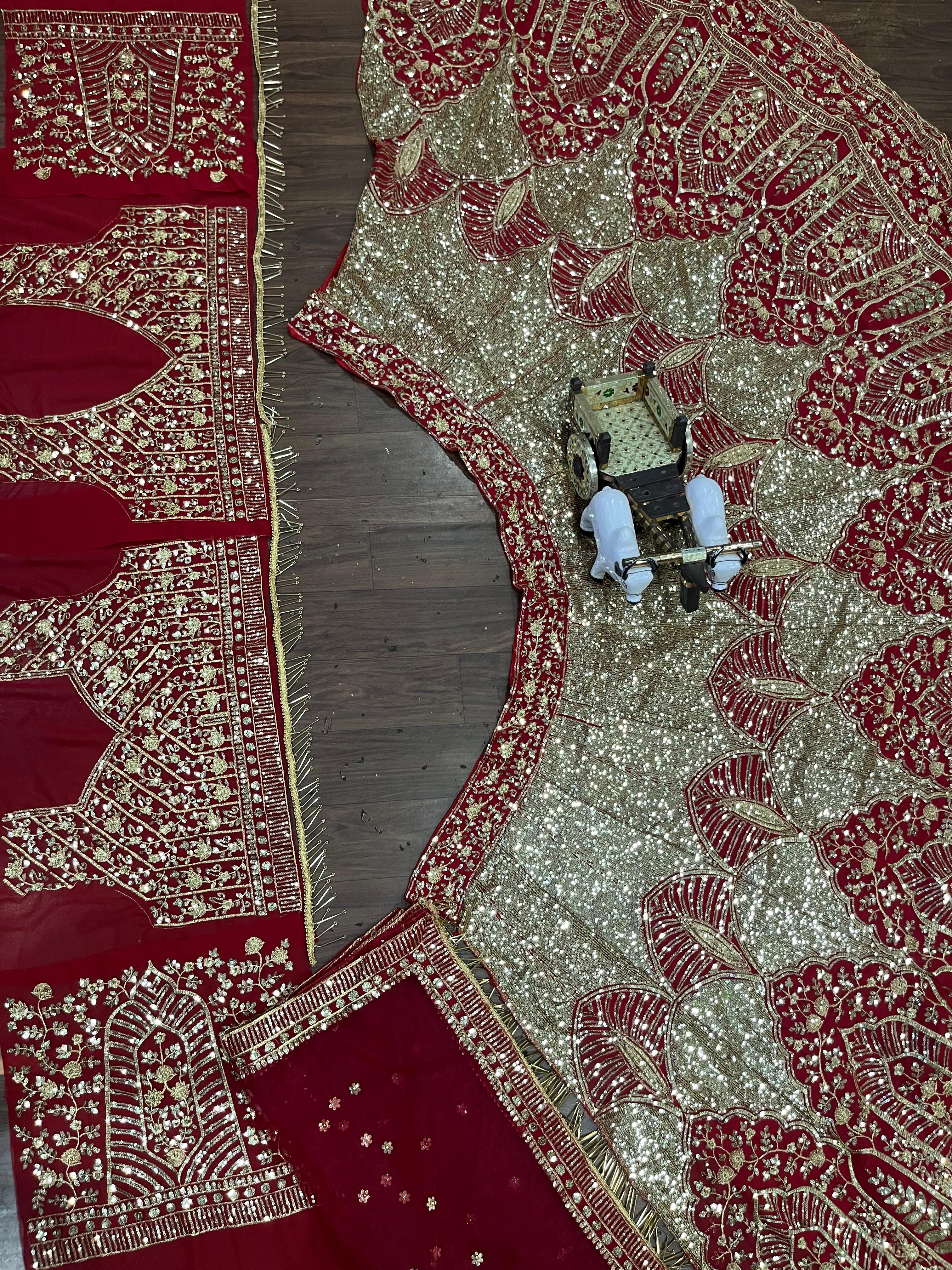 Red and Gold Heavy Embroidered Bridal Lehenga Choli with Net Dupatta