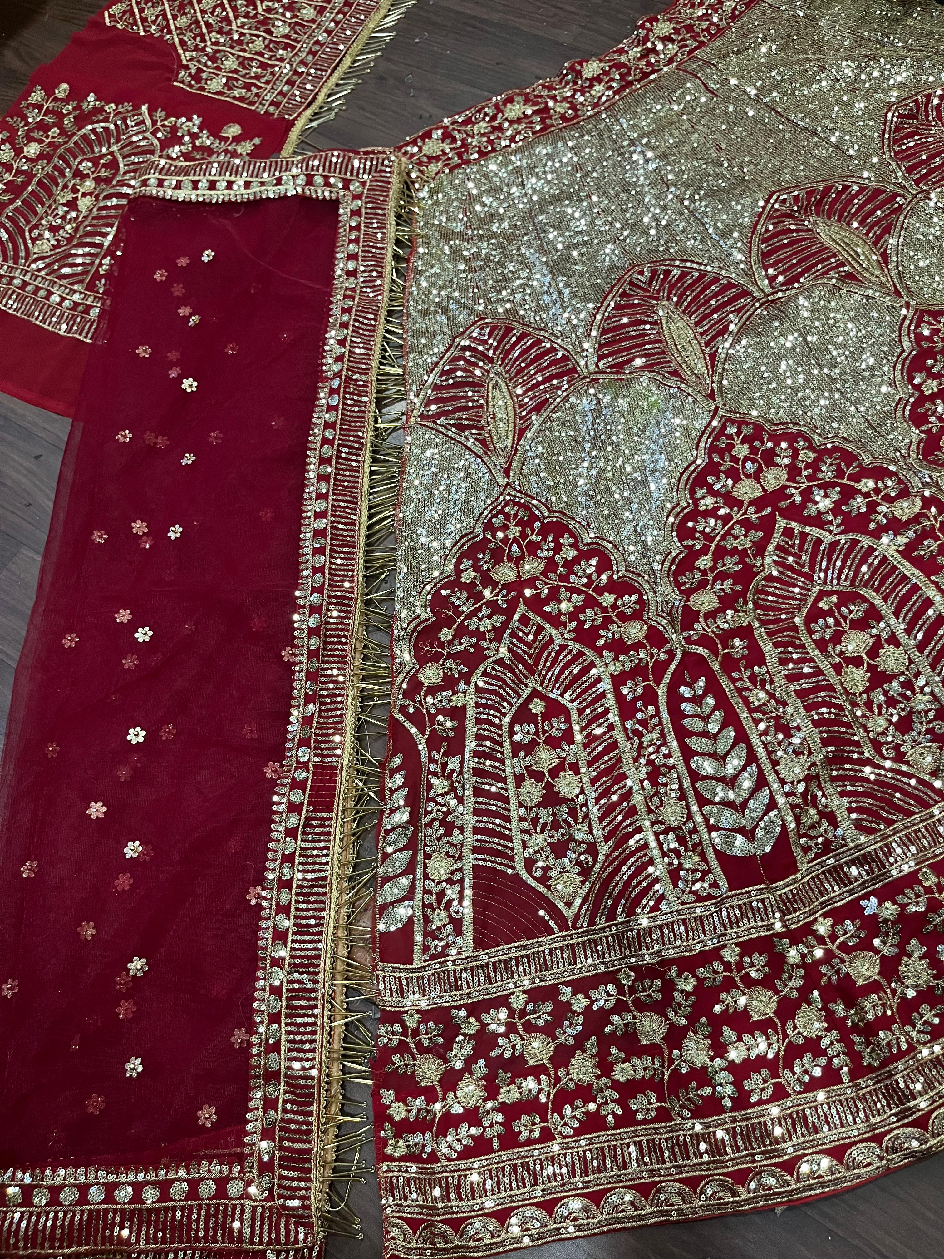 Red and Gold Heavy Embroidered Bridal Lehenga Choli with Net Dupatta