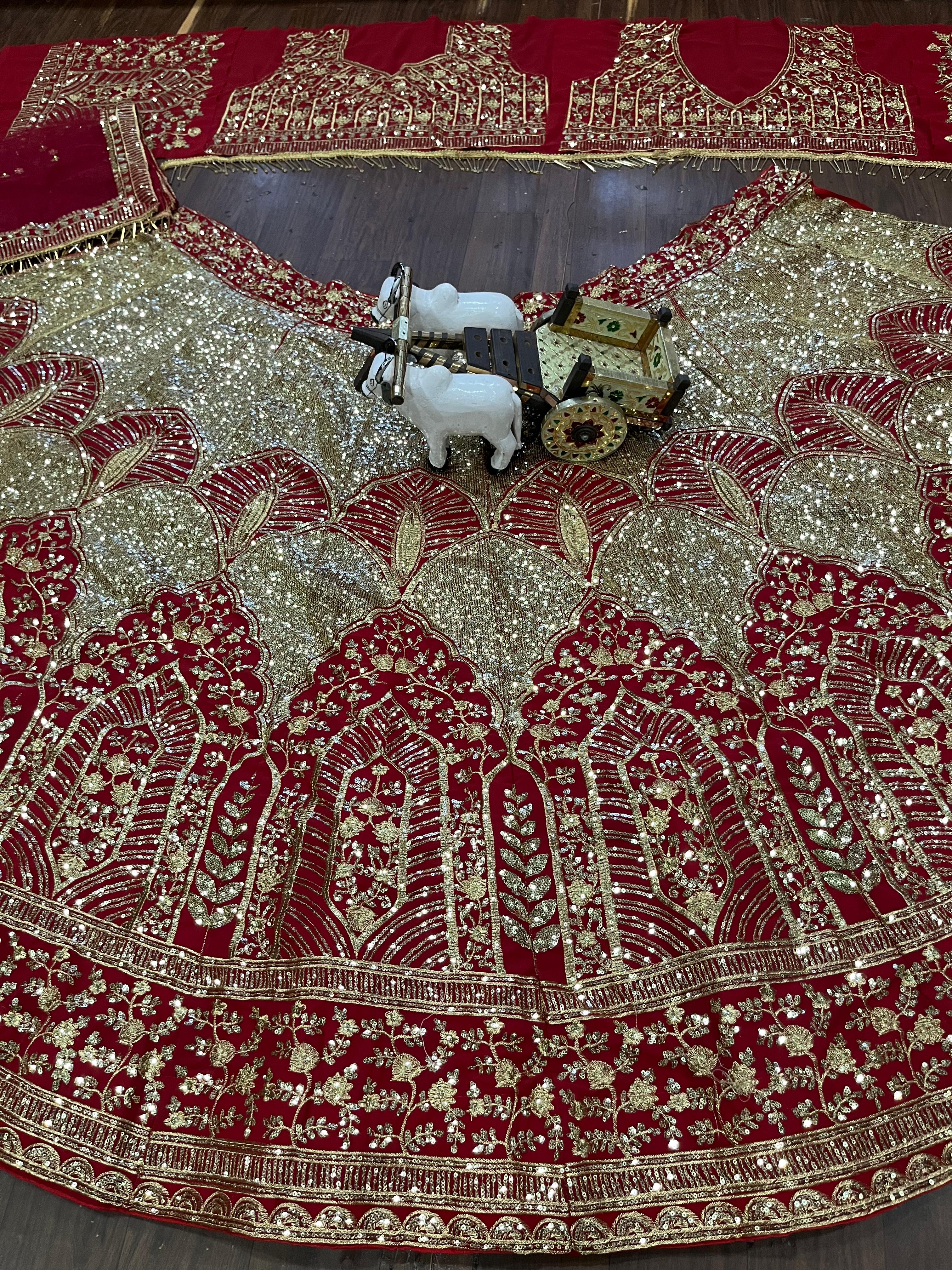 Red and Gold Heavy Embroidered Bridal Lehenga Choli with Net Dupatta