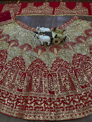 Red and Gold Heavy Embroidered Bridal Lehenga Choli with Net Dupatta